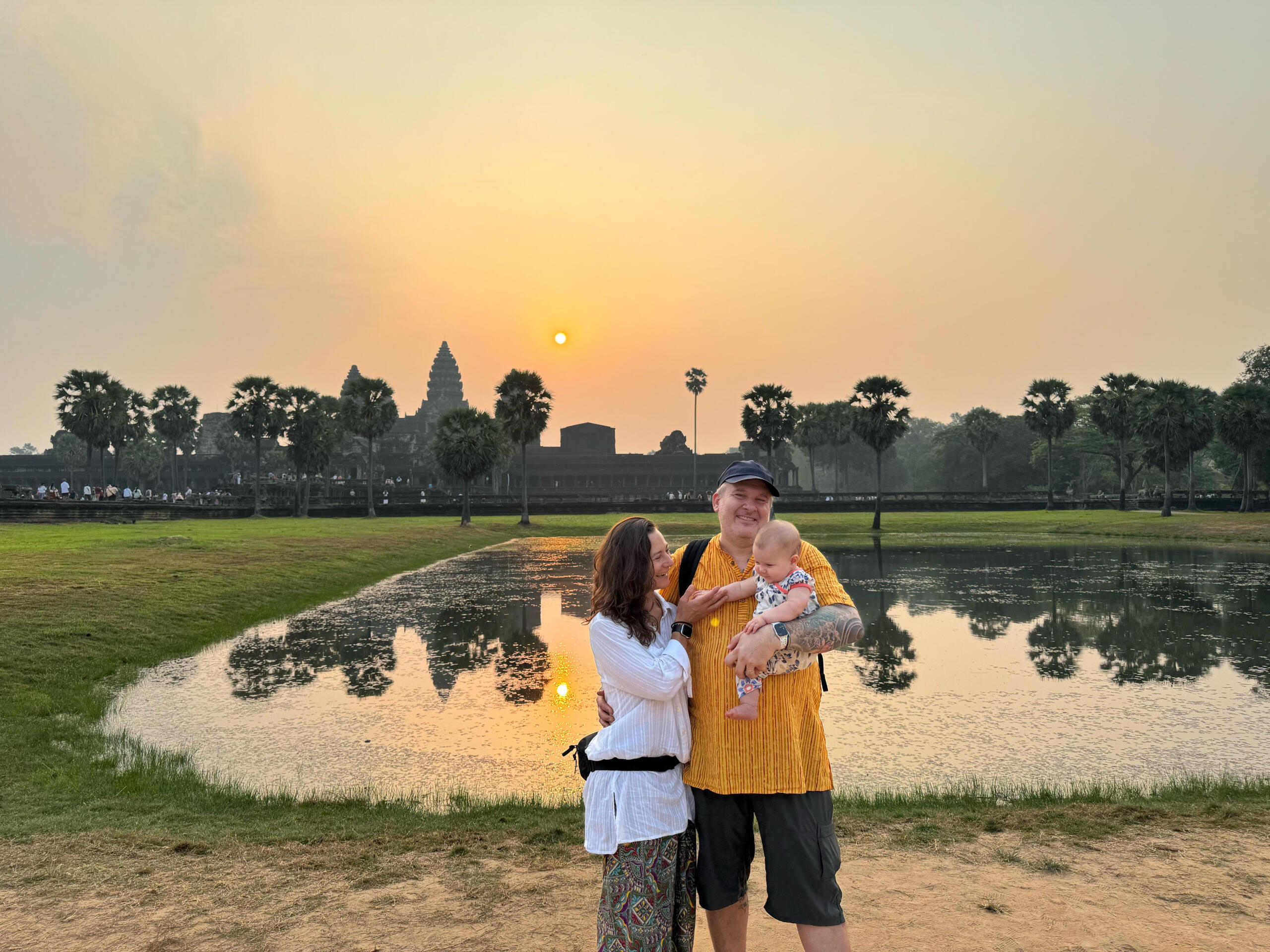 Angkor Wat sunrise Bram, Angela, and Jaya in front of Angkor Wat at sunrise